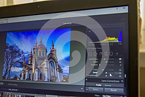 Photo editing on laptop. Photographer`s computer with professional software. Image post processing