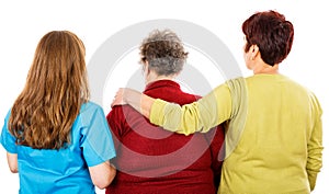 Elderly woman and young caregivers photo
