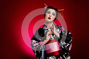 Photo of elegant stunning japanese lady in traditiona costume celebrate spring sakura festival over maroon background