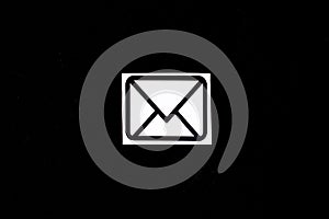 Photo of an email sign on a black background