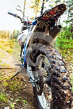 Enduro motorcycle in the mud after the race photo