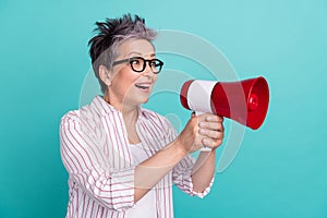 Photo of energetic activist woman grey dyed haircut holding bull horn screaming loudspeaker announcement isolated on