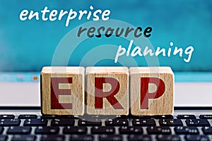 Photo on erp enterprise resource planning theme. wooden cubes with the abbreviation `erp`