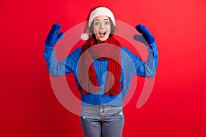 Photo of excited crazy girl in santa claus headwear raise hands imagine mittens puppet tell say communication wear