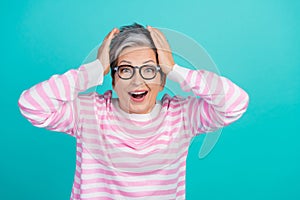Photo of excited funny woman dressed pink pullover eyewear hands arms head empty space isolated teal color background