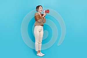 Photo of excited lady promoter using loud speaker for sharing incredible news isolated blue color background