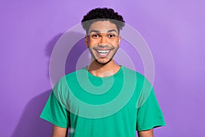 Photo of excited youngster guy listen great news overjoyed wear hipster green clothes isolated purple pastel color