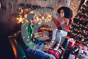 Photo of family lovers friends lady guy enjoy together christmas morning sit couch drink eggnog communicate in decor