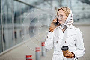 Photo of fashionable girl with beautiful brown hair smiling to c