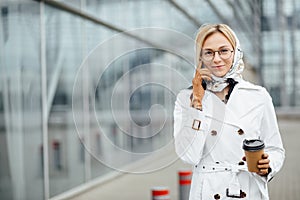 Photo of fashionable girl with beautiful brown hair smiling to c