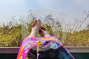 Female feet in the window