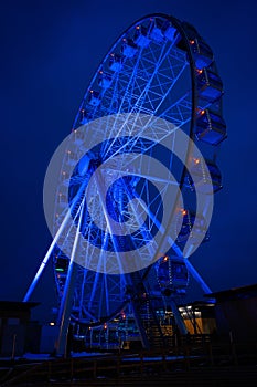 Photo of ferris wheel against background of night sky