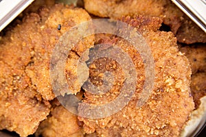 Fillet, breaded meat in marmite photo