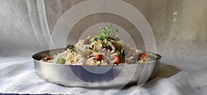 Photo of flattened rice receipe in a plate. Indian dish kanda poha. Traditional dish kande pohe. Photo of dadpi pohe.