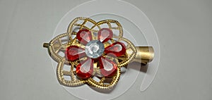 A photo of a flower shaped hair clip for women