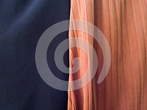 The folded blue and orange cloth background has a shadow
