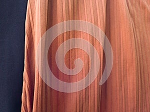 The folded blue and orange cloth background has a shadow