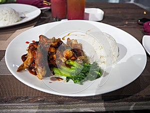 photo of food in restaurant, namely chicken with soy sauce and vegetable