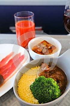 Photo of Food served on board of business class airplane on the table