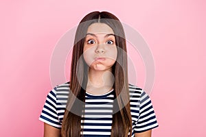 Photo of fooling funky girl dressed striped clothes big eyes bloated cheeks isolated pink color background