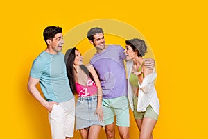 Photo of four fellows girls guys hug embrace have fun listen comic jokes isolated bright color background