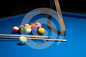 Photo fragment of the blue pool billiard game with cue. Pool billiard game. Billiard sport concept.play cue and photo