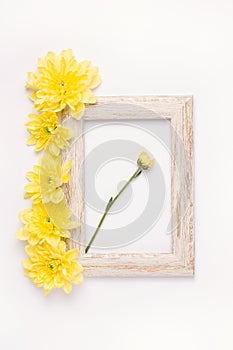 Photo frame with aster flowers on white background.
