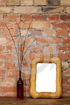 Photo frame and clay bottle with willow catkins