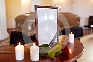 Photo frame and coffin at funeral in church