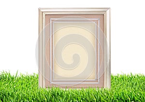 Photo frame on green grass nature