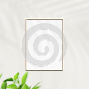Photo frame mockup on white wall. Poster mockup. Clean, modern, minimal frame. Minimalist background. Blank picture frame mockup.