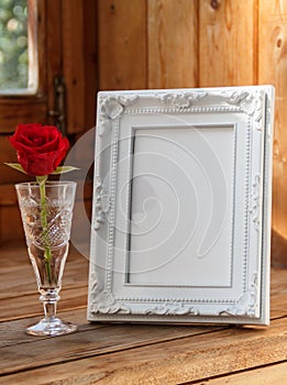 Photo frame and a red rose