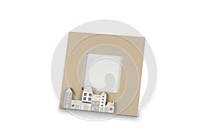 Photo frame with small houses  on white background 3D illustration