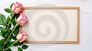 photo frame with space for text with a bouquet of roses on a light wooden background