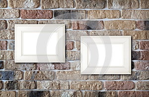 Photo frames on brick wall