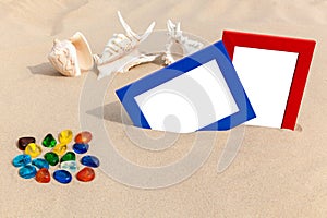 Photo frames on sand