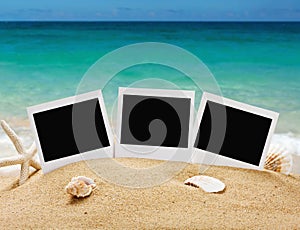Photo frames on the sea sand