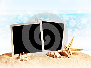 Photo frames on the sea sand