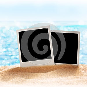 Photo frames on the sea sand