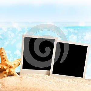 Photo frames on the sea sand