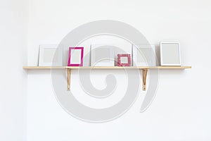 Photo frames on a shelf