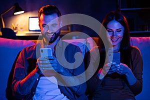 Photo of friends students lady guy sit couch evening night free time use smart device blogging web shopping photo