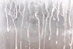 A photo with frost patterns on a window glass surface