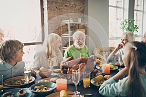 Photo of full family reunion gathering sit feast dishes turkey dinner table communicating fall november holiday multi