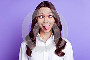 Photo of funky childish lady crossed eyes protrude tongue wear white shirt isolated purple color background photo