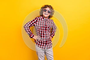 Photo of funky ginger hairstyle small boy wear eyewear red checkered shirt isolated on yellow color background