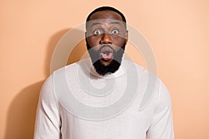 Photo of funky impressed young guy dressed white pullover big eyes isolated beige color background