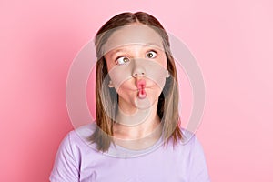 Photo of funky small positive girl make funny face careless good mood isolated on pink color background