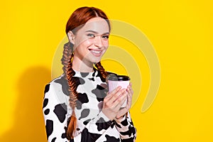Photo of funky sweet lady dressed cowskin print top enjoying cacao looking empty space isolated yellow color background photo