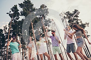 Photo of funny carefree six young buddies dressed casual outfits smiling dancing outdoors countryside